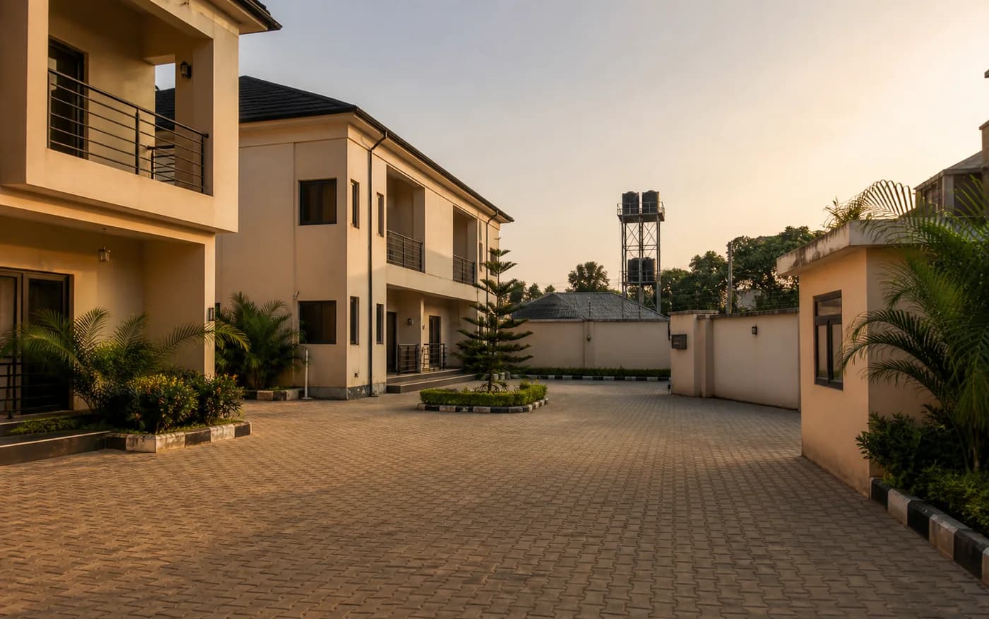 Clean Nigerian rental compound courtyard at sunset